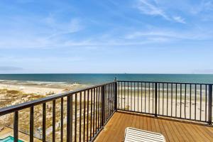 a balcony with a view of the beach at Beachfront dog-friendly home with private pool sundeck and elevator in Fort Morgan