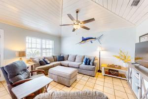 a living room with a blue fish on the ceiling at Blue Marlin in Gulf Shores