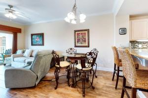a living room with a couch and a table at Crystal Tower 705 in Gulf Shores