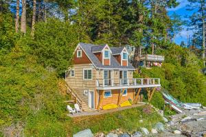 an aerial view of a house on a hill at 2BR Beachfront Cottage w/ Grill & Expansive Deck in Point Roberts