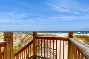 a wooden deck with a view of the beach at Sweet Alabama in Gulf Shores
