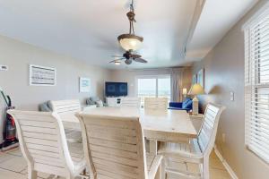 a dining room with a table and chairs at Sweet Alabama in Gulf Shores +19 photos