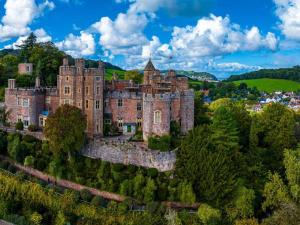 an old castle on top of a hill with trees at 2 Bed in Taunton oc-blafa in Oake