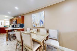 a dining room with a table and chairs at Gulfside Townhomes 23 in Gulf Shores