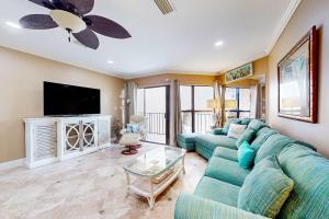 a living room with a couch and a tv at Gulfside Townhomes 23 in Gulf Shores