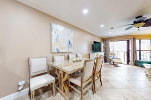 a dining room with a table and chairs at Gulfside Townhomes 23 in Gulf Shores +27 photos