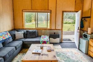 a living room with a couch and a table at The Trail Head in South Fork