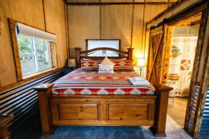 a bedroom with a wooden bed in a room at The Trail Head in South Fork