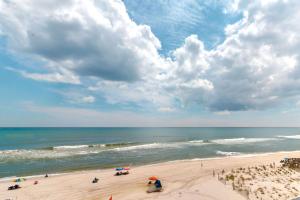 a view of a beach with people and the ocean at Gulf-front condo with breathtaking views pool in Orange Beach