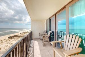 a balcony with chairs and a view of the beach at Gulf-front condo with breathtaking views pool in Orange Beach