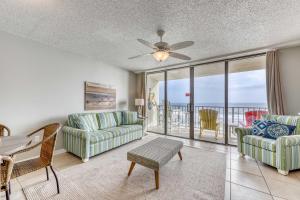 a living room with a view of the ocean at Gulf front condo with great views shared pools & beach access in Orange Beach