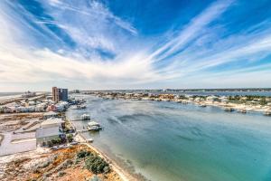 an aerial view of a beach with boats in the water at Bella Luna 1203 in Orange Beach