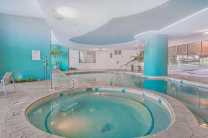 a large swimming pool in a building at Bella Luna 1203 in Orange Beach