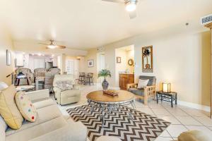a living room with a couch and a table at Broadmoor 604 in Orange Beach +43 photos