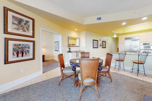 a dining room with a table and chairs at Caribe PHB12 in Orange Beach +37 photos