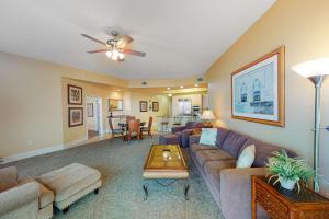 a living room with a couch and a table at Caribe PHB12 in Orange Beach
