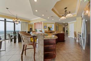 a kitchen with a large island with a counter top at Phoenix West 2601 in Orange Beach