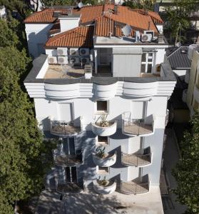an aerial view of a white building with balconies at Residence Mareo in Riccione