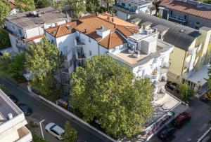 an overhead view of a white building with a red roof at Residence Mareo in Riccione