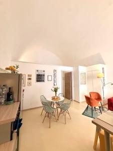 a living room with a table and chairs at La Casa di Lili in Nardò