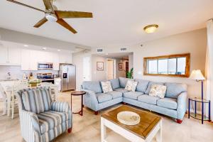 a living room with a couch and a table at Silver Beach 601 in Orange Beach