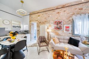 a living room with a couch and a table at Kalamoti Suites in Kalamoti