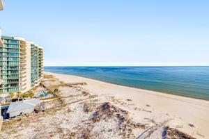 an aerial view of a hotel and the beach at Regency Isle 802 in Orange Beach