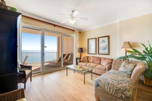 a living room with a couch and a table at Regency Isle 802 in Orange Beach
