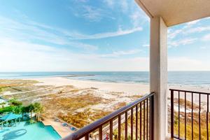 a balcony with a view of the beach at Phoenix East 702 in Orange Beach