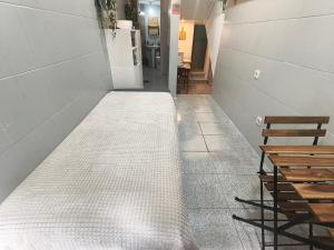 a hallway with a mattress on the floor of a room at Estúdio Madragoa in Lisbon