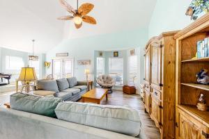 a living room with a couch and a table at Sunset Beach in Dauphin Island