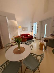 a living room with a table and chairs at La Casa di Lili in Nardò +14 photos