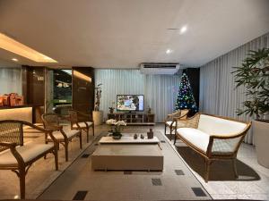 a living room filled with furniture and a christmas tree at Hotel Golden Park Salvador By Nacional Inn in Salvador