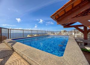 a swimming pool on top of a building at Hotel Golden Park Salvador By Nacional Inn in Salvador
