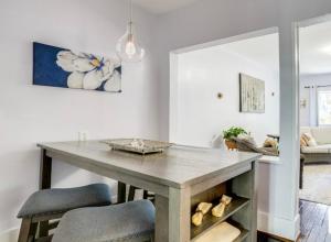 a kitchen with a table with two chairs and a table at Swimming Under The Stars In The Historical District in Lynchburg