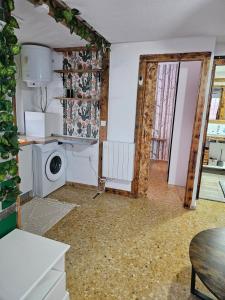 a kitchen with a washer and dryer at Sky Apartment in Miramar