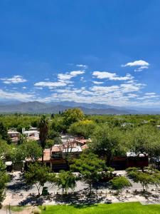 a view of a park with trees and buildings at Casa Akbar in La Cieneguita