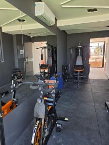 a room with a bike parked in a gym at Flat Só Alegria in Cabedelo