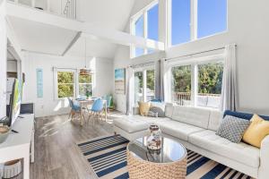 a living room with a couch and a table at 4068 - Family Tradition in Kitty Hawk