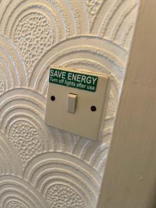 a sign that says save energy on a wall at Mayfair hotel Blackpool city centre in Blackpool +53 photos