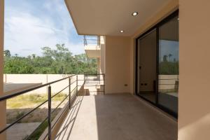 a balcony of a house with a view at Modern 2BR Condo Close to Downtown Cabo in Cabo San Lucas +58 photos