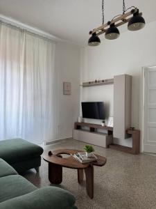 a living room with a couch and a coffee table at Mary 's Home in Caserta