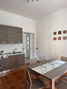 a kitchen and dining room with a table and chairs at Mary 's Home in Caserta +27 photos