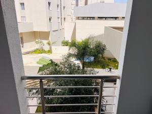 a view from the top of a stairway in a building at Modern Oasis near Airport & Lac 2 - Wahat Aouina in El Aouina Station