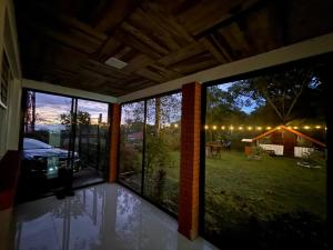 a screened in porch with a view of a yard at Cumbre Serena by Montea in Empalme