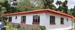 a small house with an orange roof at Cumbre Serena by Montea in Empalme
