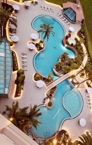 an overhead view of the pool at a resort at Torres de Suites by InAmazonas in Quito