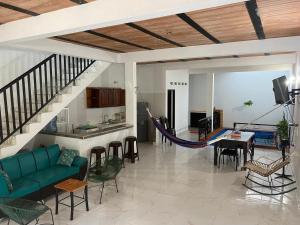 a living room with a couch and a hammock at Casa Armonia in Honda