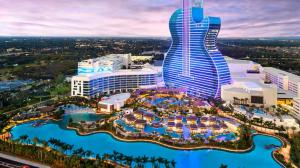 an aerial view of a resort with a pool at Miramar Retreat Arcade Game Room King Bed 25 Min to Hollywood Beach in Miramar