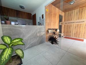 a lobby with a sign that reads akrotiri nordica at Pousada Primeiro Sol in João Pessoa